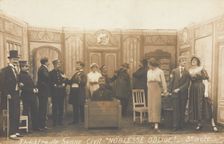 Prisoners of war, some in drag, posing on stage during a crowded scene of "Noblesse...(1910-1919?). Creator: Unknown