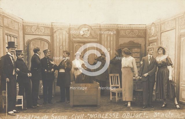 Prisoners of war, some in drag, posing on stage during a crowded scene of "Noblesse...(1910-1919?). Creator: Unknown.