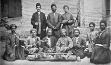 Prisoners and gaolers in a prison yard, Nahavand, Persia, 1902