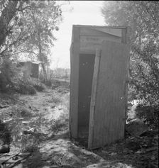 Privy in cotton camp for migratory workers, California, 1936. Creator: Dorothea Lange