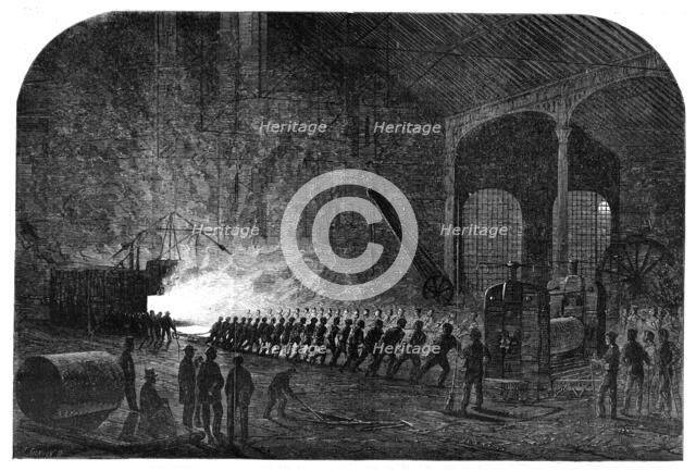 Process of rolling armour-plates for Her Majesty's ships at the Atlas Steelworks, Sheffield, 1861. Creator: Mason Jackson.
