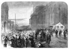 Progress of the Great International Exhibition building: the workmen leaving the grounds, 1861. Creator: Frederick John Skill