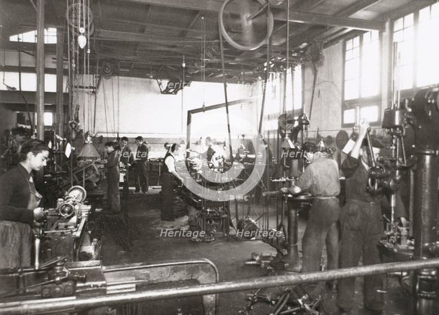 Production line of a company who manufacture motorcycle components, Barcelona, Spain, 1945.  Creator: Unknown.