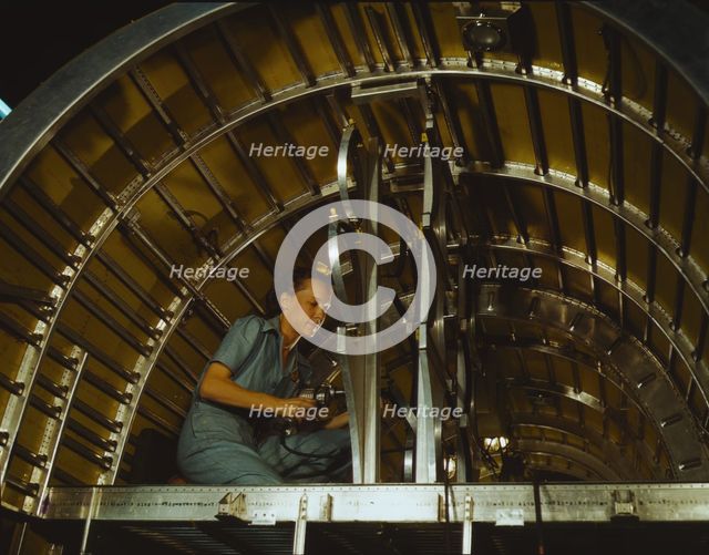 Production of B-24 bombers and C-87 transports, Consolidated Aircraft Corp., Fort Worth, Texas, 1942 Creator: Howard Hollem.