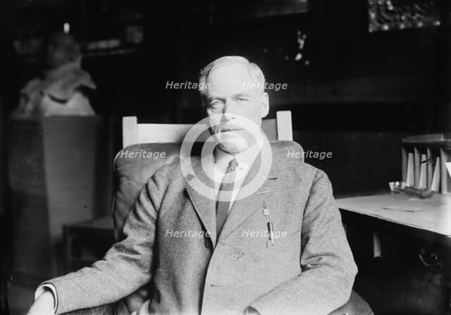 Prof. Jeremiah W. Jenks seated in study, 1912. Creator: Bain News Service.