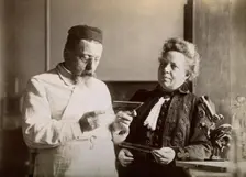 Professor and Mrs Dejerine looking at a microscopic sample of the human brain, c1900s. Creator: Unknown