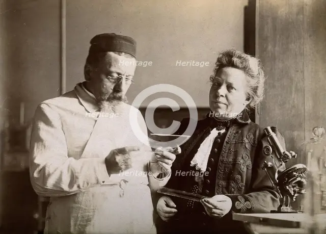 Professor and Mrs Dejerine looking at a microscopic sample of the human brain, c1900s. Creator: Unknown.
