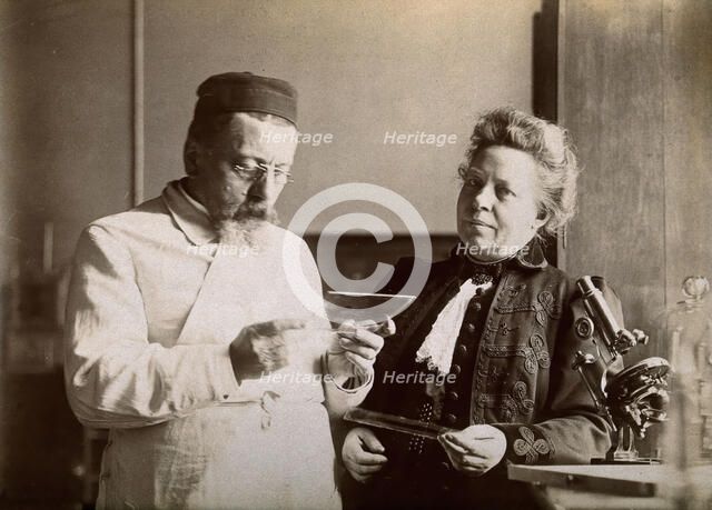 Professor and Mrs Dejerine looking at a microscopic sample of the human brain, c1900s. Creator: Unknown.