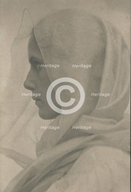 Profile portrait of woman draped with a veil, c1900. Creator: Amelia Van Buren.
