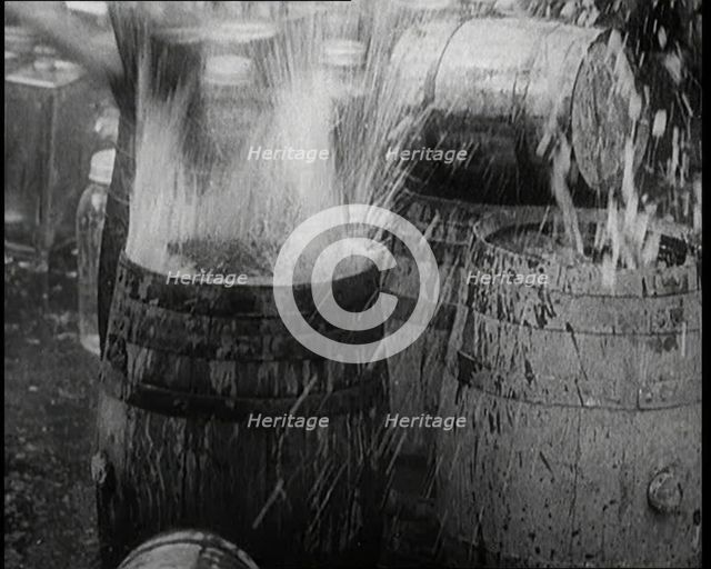 Prohibition Scenes in the United States of America. Barrels of Alcoholic Beverages Being..., 1920. Creator: British Pathe Ltd.