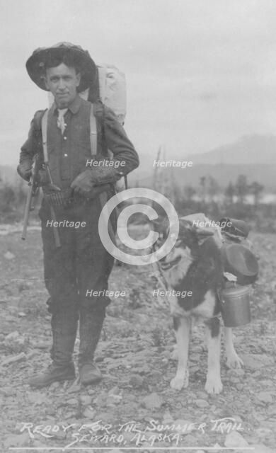 Prospector and dog ready for the summer trail, between c1900 and 1916. Creator: Unknown.