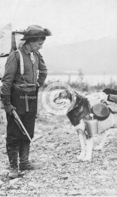 Prospector and dog ready for the summer trail, between c1900 and c1930. Creator: Unknown.