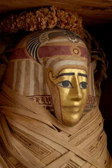 Ptolemaic coffin, mummy with gilt mask and floral garlands, Roman Period (Egypt), c30BC-AD641