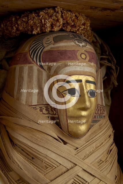 Ptolemaic coffin, mummy with gilt mask and floral garlands, Roman Period (Egypt), c30BC-AD641. Artist: Unknown.