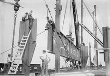 Putting 46 ton girder in place - Cons. Gas Co's Bldg., 1913. Creator: Bain News Service