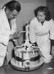 Putting the finishing touches to Sir Winston Churchill's birthday cake, 1953. Creator: Unknown