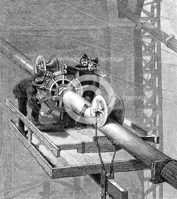 Putting wire wrapping around the suspension cables, Brooklyn Suspension Bridge, 1883. Artist: Unknown
