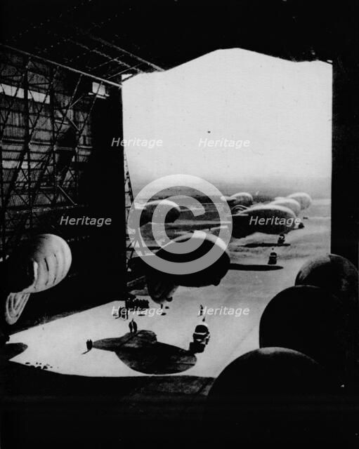 Putting barrage ballons into a hangar, 1943. Artist: Unknown.