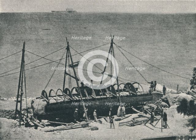 'Putting on the Casing', 1877, (1910). Creator: Unknown.