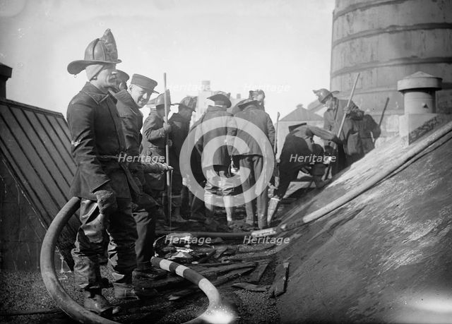 Putting out fire in Bain News Service Bldg. 1/6/12, 1912. Creator: Bain News Service.