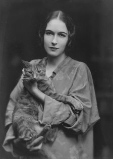 Pujo, Mona, Miss, with Buzzer the cat, portrait photograph, 1916. Creator: Arnold Genthe