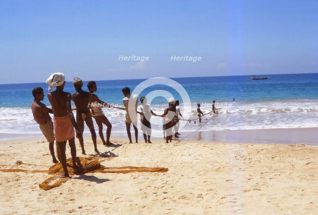 Pulling in Fishing Net from Indian Ocean, Hikkaduwa, West Coast Sri Lanka, 20th century. Artist: CM Dixon.