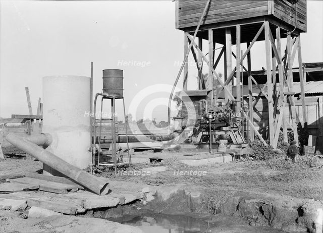 Pumping plant for irrigation powered by a natural gas engine, Tulare County, California, 1938. Creator: Dorothea Lange.