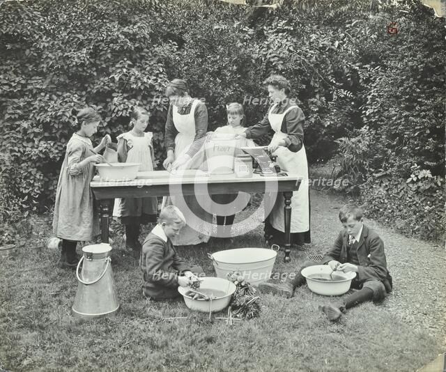 Pupils preparing food outdoors, Birley House Open Air School, Forest Hill, London, 1908. Artist: Unknown.