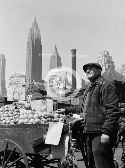 Push cart fruit vendor at the Fulton fish market, New York, 1943. Creator: Gordon Parks.