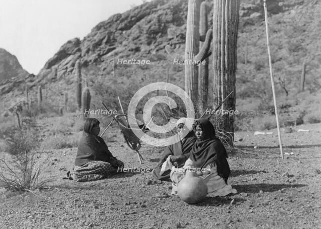Qahatika women resting in Harvest Field-Qahatika, c1907. Creator: Edward Sheriff Curtis.