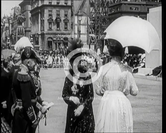 Queen Alexandra Shaking Hands With Male Officers Next to Queen Mary, 1921. Creator: British Pathe Ltd.