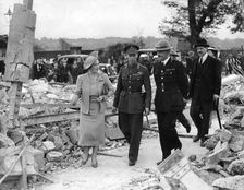 Queen Elizabeth and King George VI inspecting air raid damage, World War II, 1940-1945. Creator: Unknown