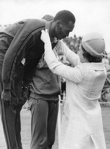 Queen Elizabeth II awards Kip Keino his gold medal, Commonwealth Games, Edinburgh, 1970