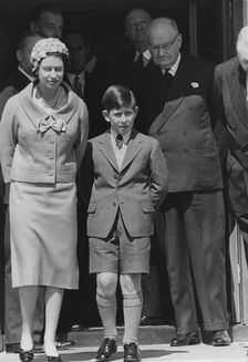 Queen Elizabeth II and Prince Charles wait at London Airport for Prince Philip, April 1959. Creator: Unknown