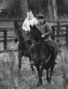 Queen Elizabeth II and Princess Anne riding through Anmer Village, near Sandringham, 1981