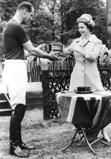 Queen Elizabeth II presents the Duke of Edinburgh with the Horse Show Cup, Windsor Great Park, 1963