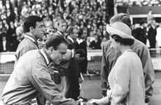 Queen Elizabeth II shaking hands with England footballer George Cohen, World Cup, Wembley, 1966. Artist: Unknown