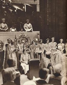 Queen Elizabeth looks on as her husband is crowned on the day of his coronation 1937. Creator: Unknown