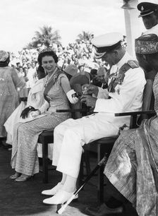 Queen Elizabeth shows Prince Philip a gift, Port Loko, Sierra Leone, 1961