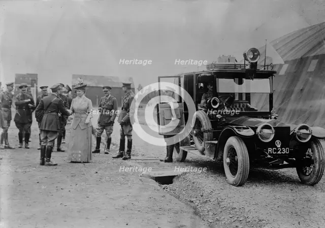 Queen Mary visits aerodrome shed, 5 Jul 1917. Creator: Bain News Service.