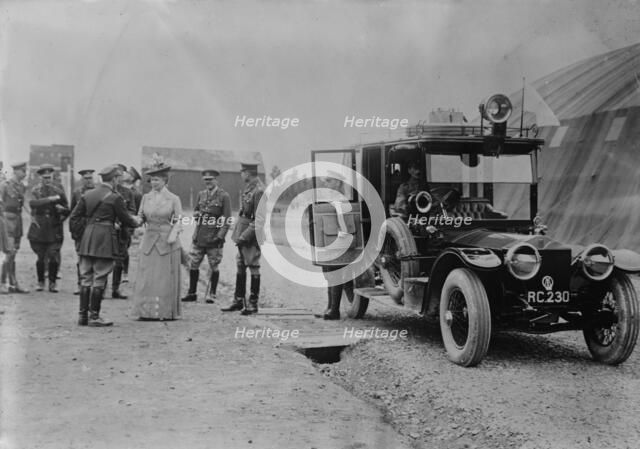 Queen Mary visits aerodrome shed, 5 Jul 1917. Creator: Bain News Service.