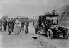 Queen Mary visits aerodrome shed, 5 Jul 1917. Creator: Bain News Service