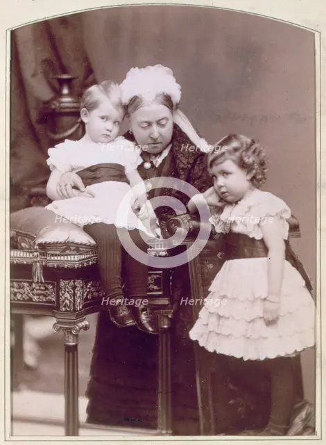 Queen Victoria with two of her grandchildren, April 1886. Creator: Alexander Bassano.