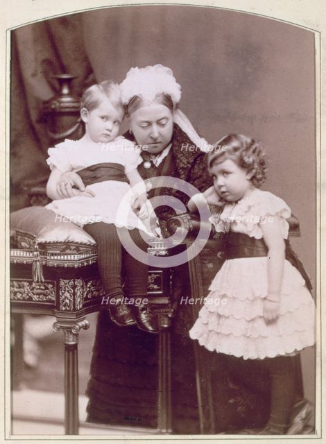 Queen Victoria with two of her grandchildren, April 1886. Creator: Alexander Bassano.