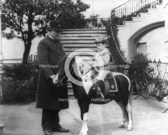 Quentin Roosevelt instructed in horsemanship at the White House, c1902 June 17. Creator: Frances Benjamin Johnston.