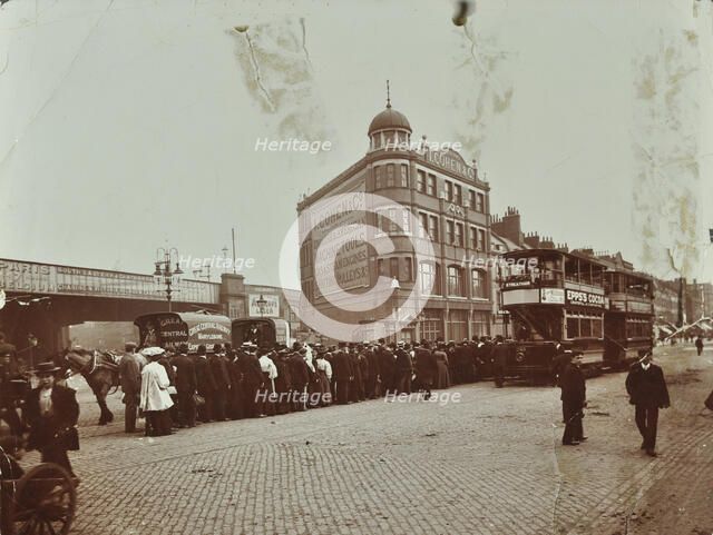 Queue of people at a bus stop in the Blackfriars Road, London, 1906. Artist: Unknown.