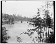 Quinnesee [sic] Falls, Mich., the river above the falls, between 1880 and 1899. Creator: Unknown