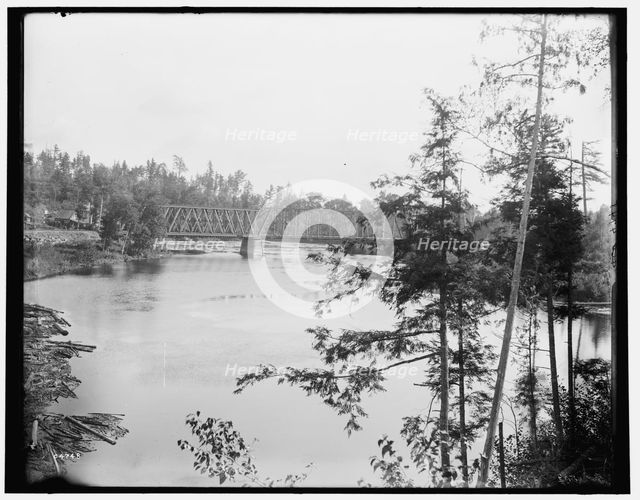 Quinnesee [sic] Falls, Mich., the river above the falls, between 1880 and 1899. Creator: Unknown.