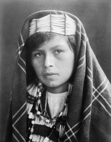 Quinault female head-and-shoulders portrait, facing slightly left, c1913. Creator: Edward Sheriff Curtis