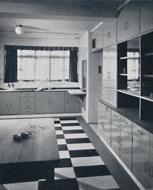 R. W. Symonds and Partner, L. & A.R.I.B.A. - Kitchen: Putty-coloured cellulosed fiitments, stainles